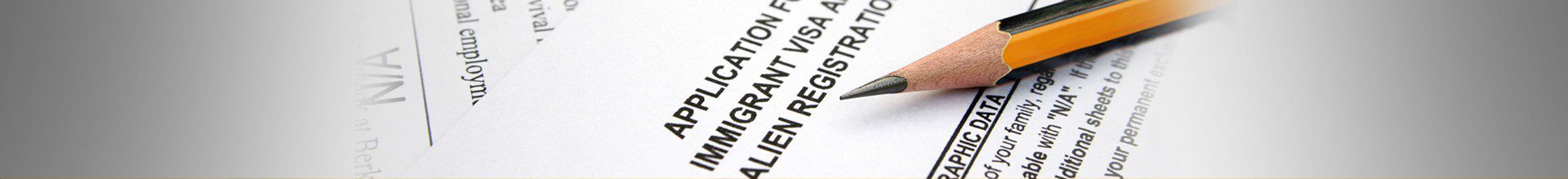 Immigration form with pencil on top.