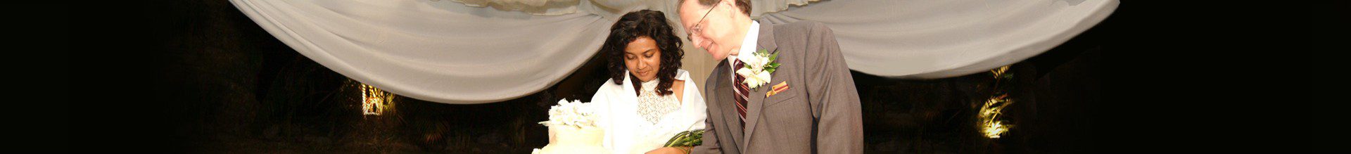 Bride and groom at wedding ceremony altar.